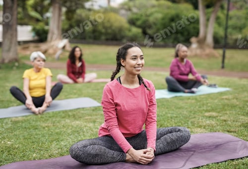 Preview: Multi generational women doing yoga exercise at park - Multiracial people doing sport outdoor