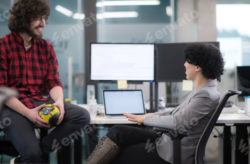 Preview: software developers couple writing programming code