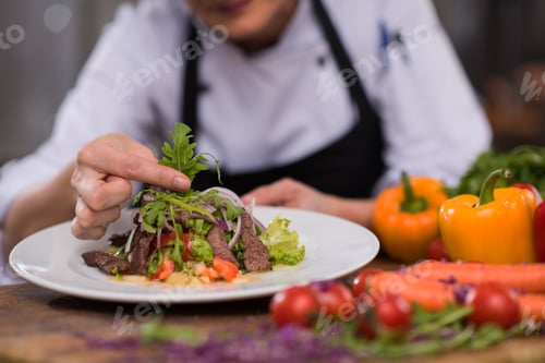 Preview: cook chef decorating garnishing prepared meal