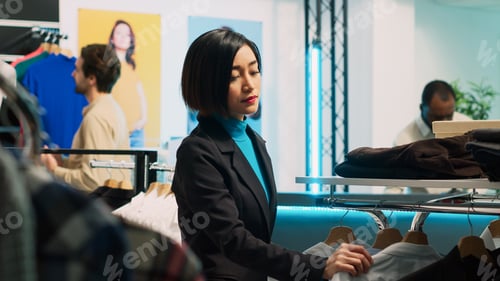 Preview: Young client shopping in fashionable boutique shop
