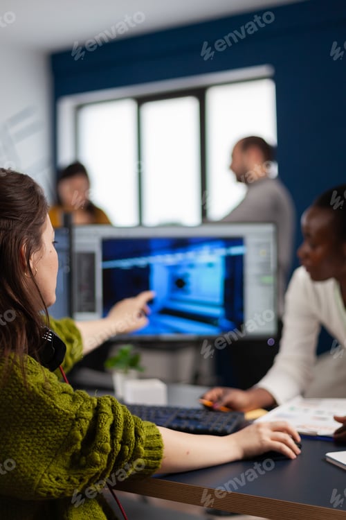 Preview: Gamer creator explaning to african worker how develop game level interface