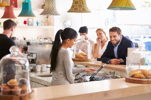 Preview: People ordering at the counter in a cafe