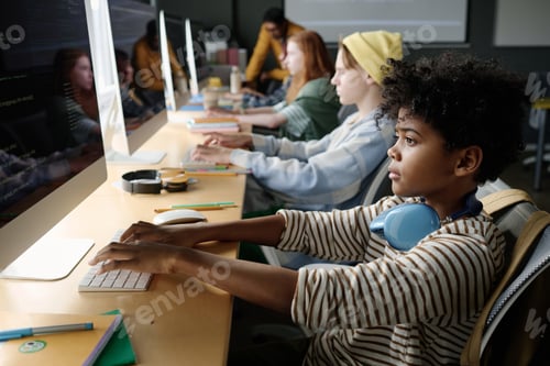 Preview: Black Boy Focused On Coding In Class