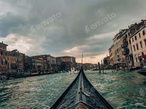 Preview: Boat sailing in the Grand canal on a gloomy day in Venice, Italy