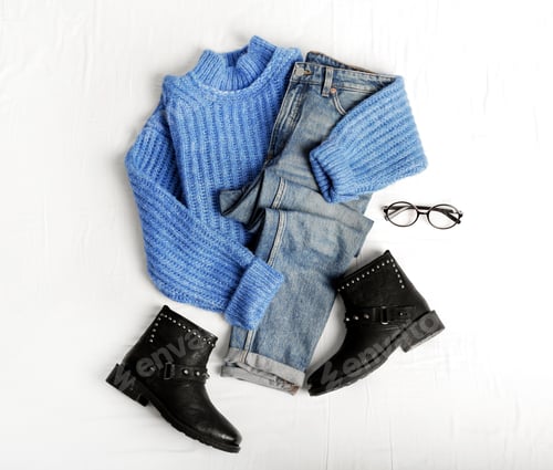 Preview: Flat lay composition with jeans, sweater and shoes on white fabric