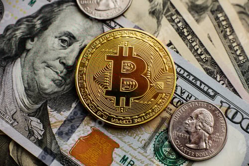 Preview: Bitcoin, Currency, digital, finance, economy. Golden bitcoin coin on us dollars close up