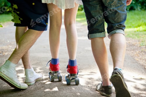 Preview: Teenage boys with roller skating girl