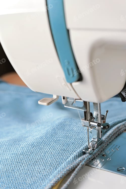 Preview: Sewing Machine. The Process Of Sewing A Decorative Cord Of Blue Fabric.