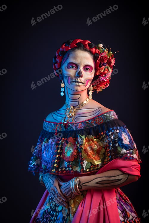 Preview: Latina woman dressed as a Mexican Catrina, with bold skull makeup