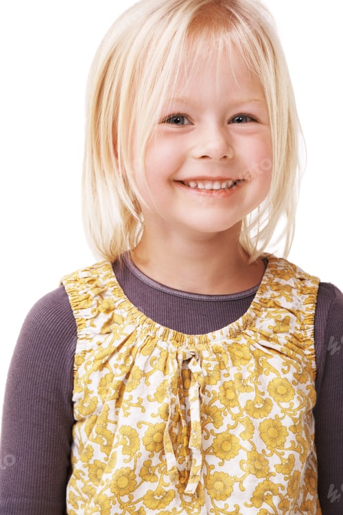 Preview: Portrait of a cute little girl smiling and standing against a white background