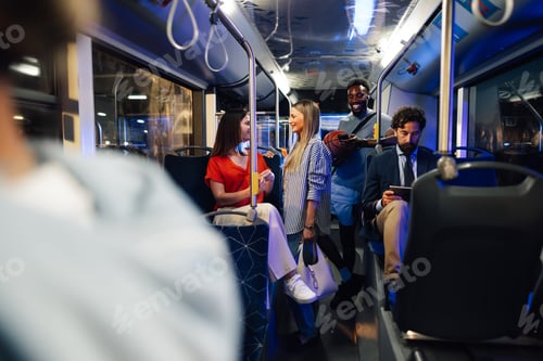 Preview: Diverse group of people riding a modern city bus at night