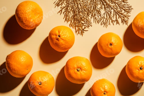 Preview: Flat lay with wholesome mandarins and decorative golden twig on beige background