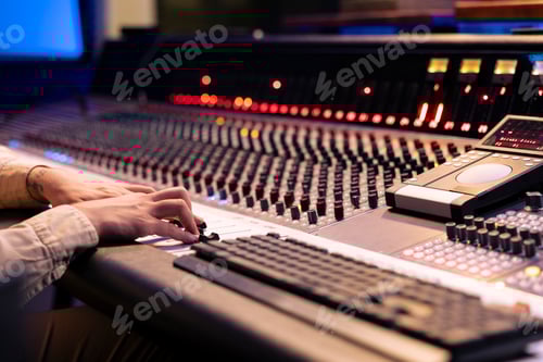 Preview: Sound Engineer Working at a Mixing Console