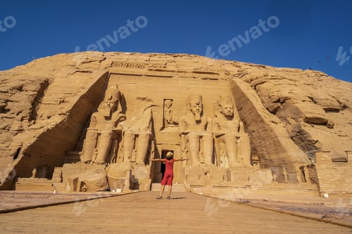 Preview: A European tourist in red dress at the Abu Simbel Temple in southern Egypt