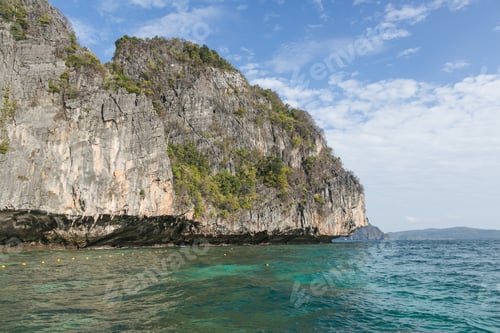 Preview: beautiful scenic view of rocky formations covered with plants and ocean, phi phi islands