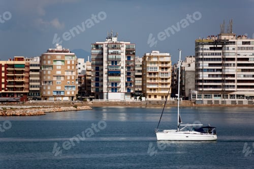 Preview: A yacht sailing by the waterfront of Torrevieja on the Costa Blanca in southern Spain.