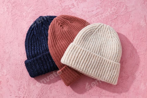 Preview: Multicolored warm hats on a pink background