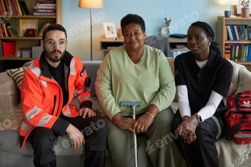 Preview: Portrait of Middle Aged Black Woman with Disability Sitting with Paramedics