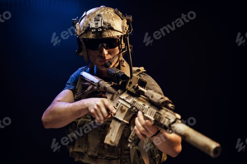 Preview: Special forces soldier with rifle on black background