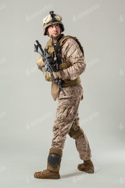 Preview: Soldier moves through training area with weapon ready during daytime exercise