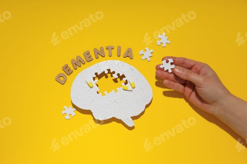 Preview: Puzzle brain with missing elements on a yellow background