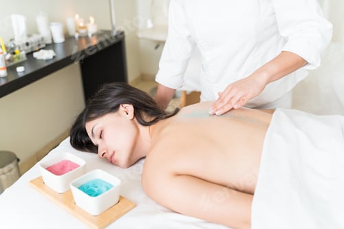 Preview: Latin Customer Relaxing During Dead Skin Treatment At Spa