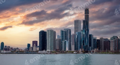 Preview: Chicago Illinois skyline, sunset time, waterfront skyscrapers blue cloudy sky background, USA