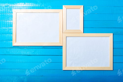 Preview: photo frames on the wooden wall