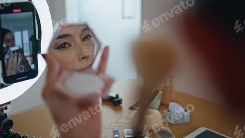 Preview: Influencer woman applying makeup looking mirror at house closeup. Blogger visage