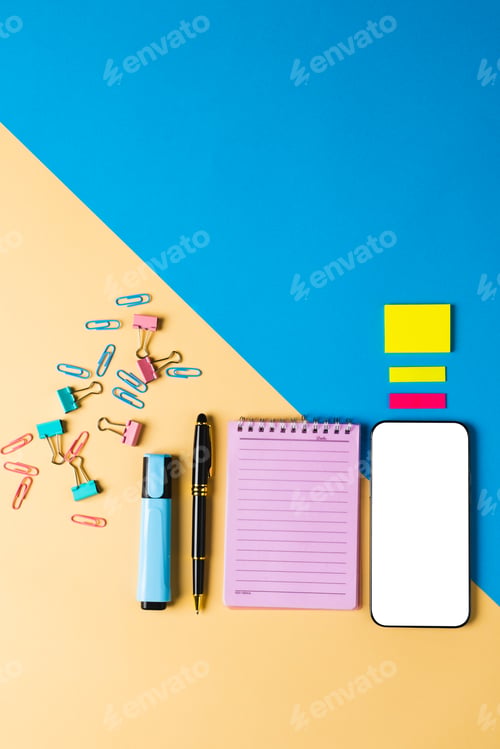 Preview: Vertical composition of smartphone with copy space, notebook and tools on yellow and blue surface