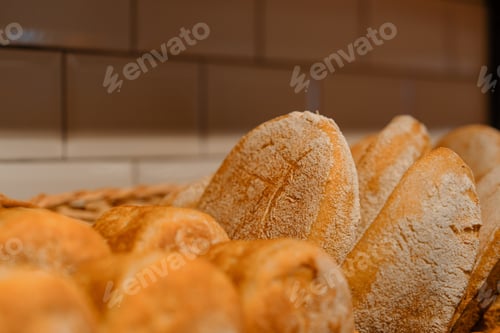Preview: Freshly baked bread is served in baskets on the bakery counter close-up view
