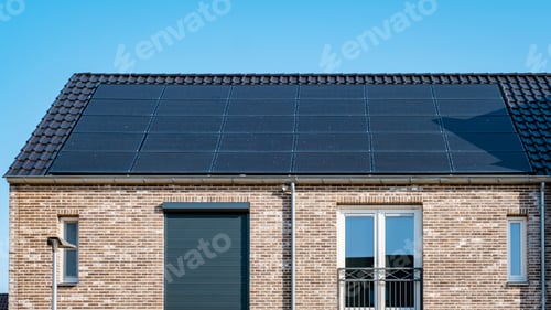 Preview: Newly build houses with solar panels attached on roof against a sunny sky Close up of solar pannel