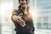 Preview: Cropped shot of an unrecognizable businesswoman gesturing a handshake in a modern office