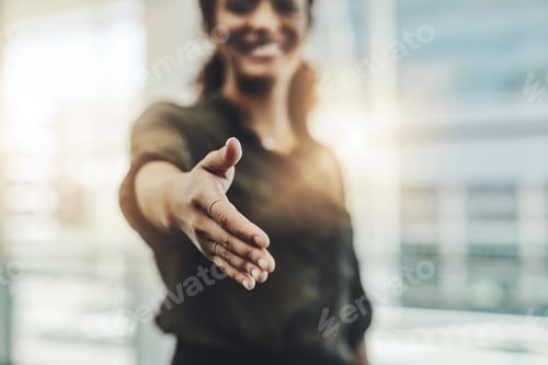 Preview: Cropped shot of an unrecognizable businesswoman gesturing a handshake in a modern office