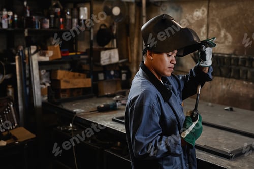 Preview: Portrait Of Modern Woman Welding Metal