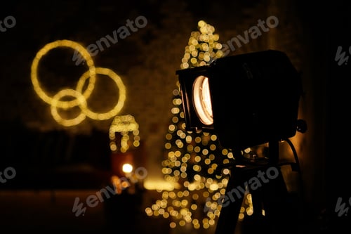 Preview: New Year 2022. interior with candles, bulbs and bokeh. Room decorated to celebration. Christmas tree