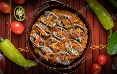 Preview: Cockles sauteed in curry powder with bell peppers and tomatoes.