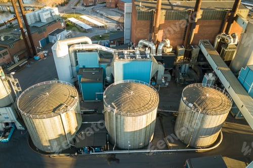 Preview: Aerial view of big fuel reservoirs in petroleum industrial zone and metal exhaust pipes of oil