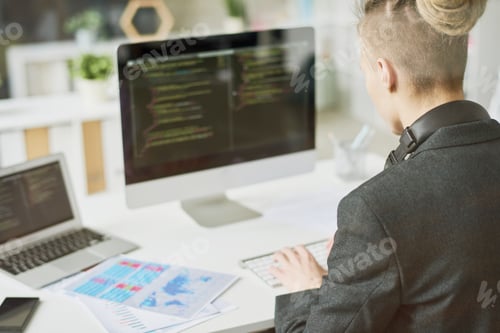 Preview: Creative Young Web Developer Writing Code