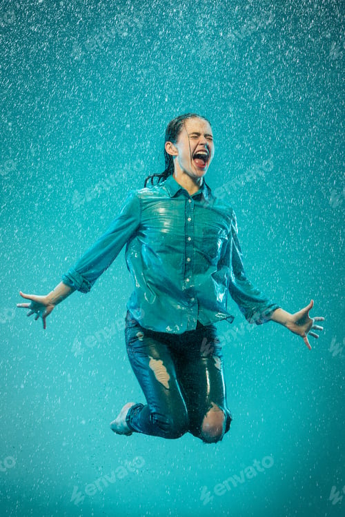 Preview: The portrait of young beautiful woman in the rain