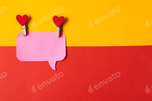 Preview: pink notes on a yellow-red background and clothespins with hearts