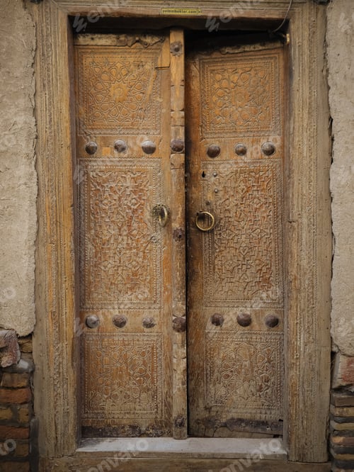 Preview: Aged wooden door in metal rivets