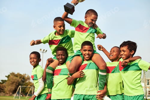 Preview: Shot of a boys soccer team celebrating their victory on a sports field