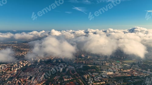 Preview: Aerial view of Barcelona City skyline above the clouds and fog, Catalonia, Spain