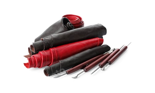 Preview: Leather samples and craftsman tools isolated on white