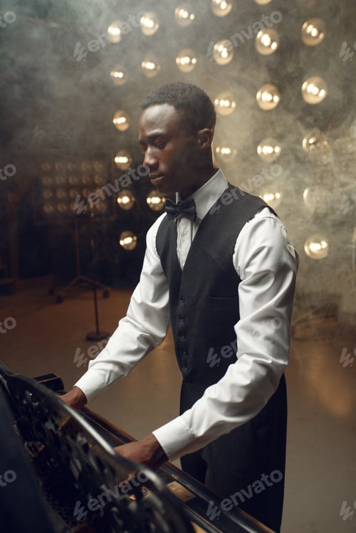 Preview: Black grand piano player playing on the stage