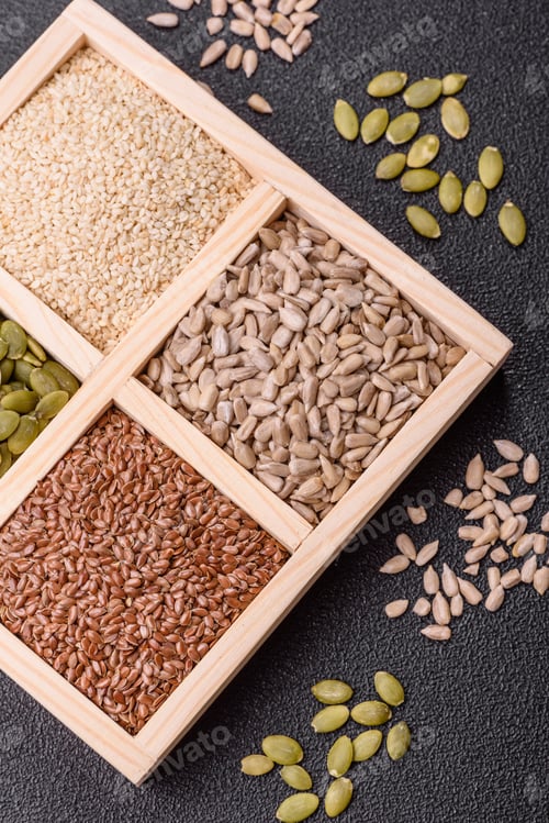 Preview: Sunflower, pumpkin, flax and sesame seeds in a wooden box