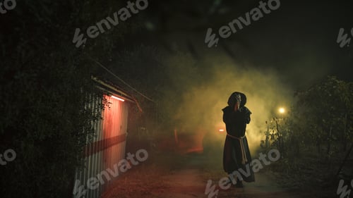 Preview: Monk alone outdoor on hallooween night