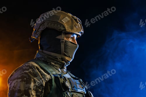 Preview: Portrait of a Tactical Soldier in Combat Gear against an Intense Orange and Blue Background