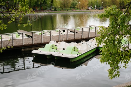 Preview: Pier with catamarans for walking on water ine public park outside